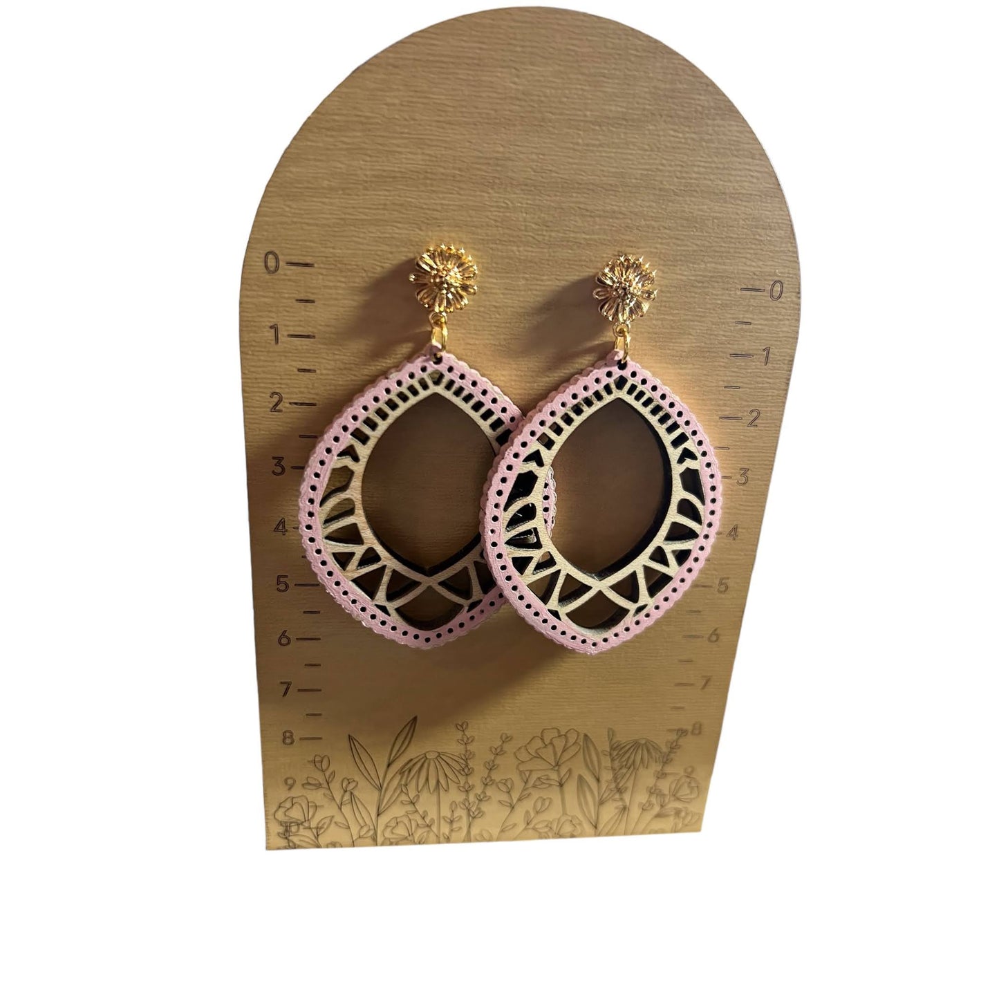 Light Wood With Pink Accents And Gold Posts